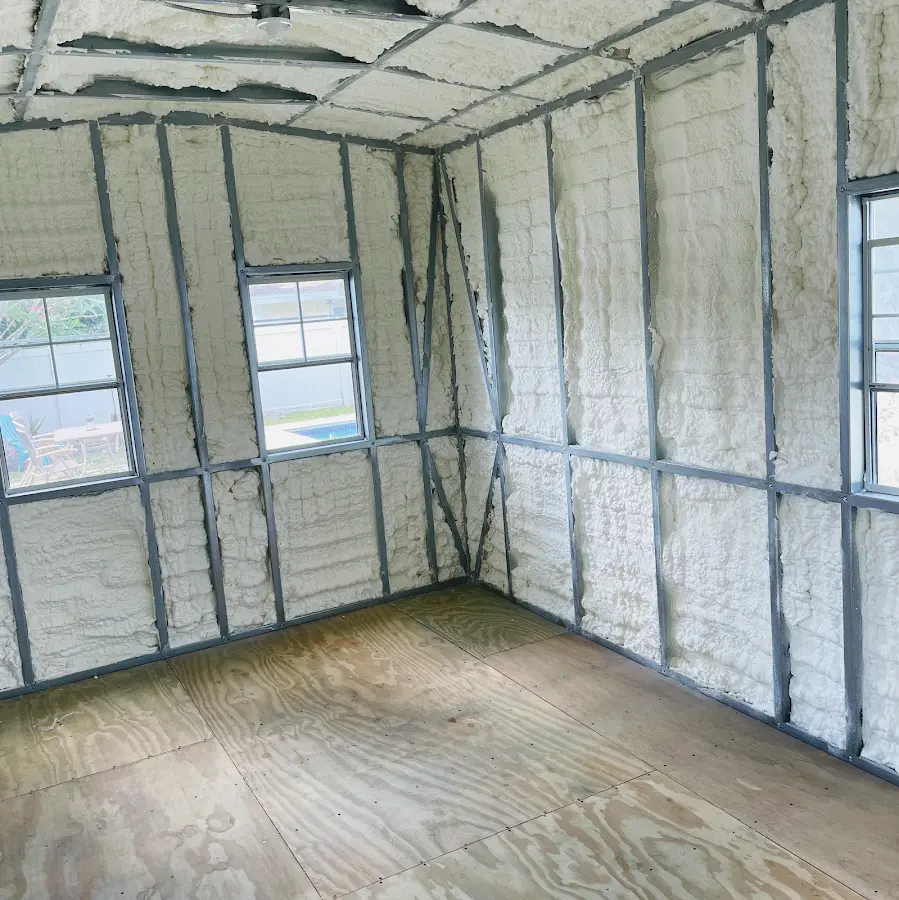 Closed-cell spray foam insulation applied to wall cavities in a residential project in Clovis